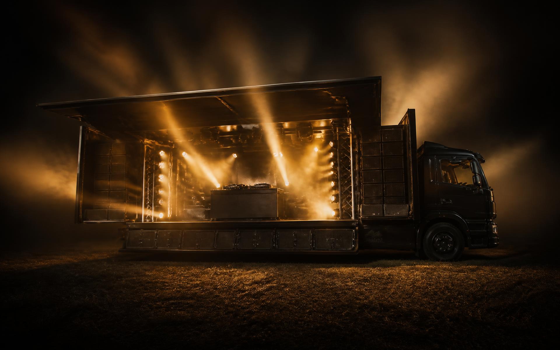 BOOTH lit up at night in an open field